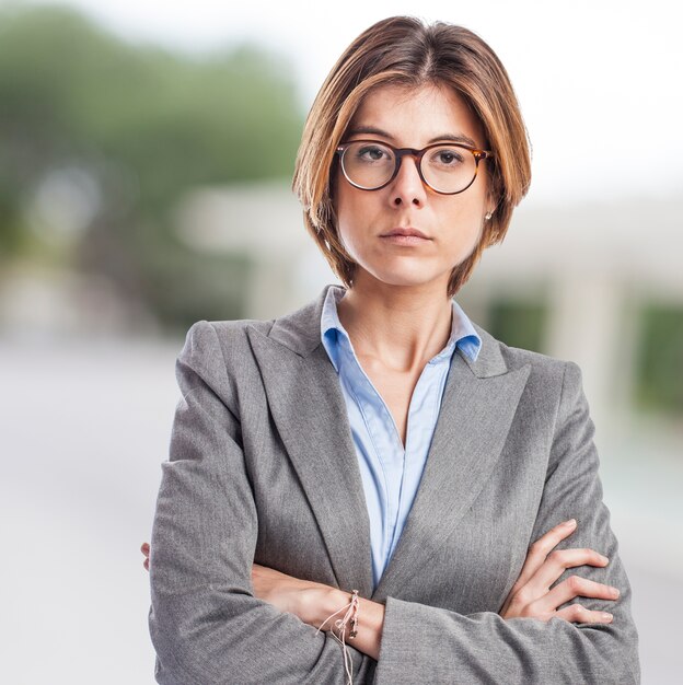 Serious executive with short hair and crossed arms