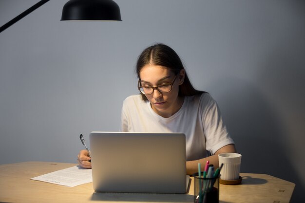 Serious female student preparing for exam