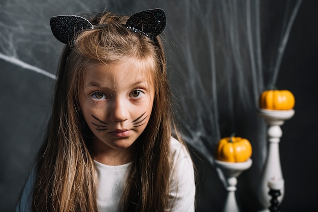 Serious girl in cat costume