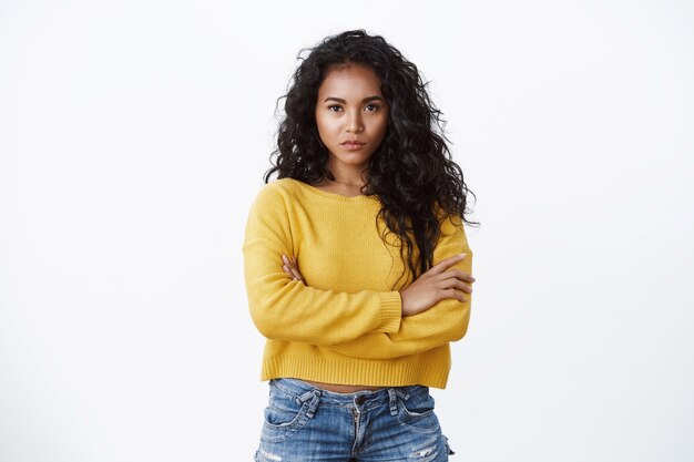 Serious-looking pressured gorgeous african american girlfriend wear yellow sweater, cross arms chest defensive, frowning look gloomy and upset, staring offended, have complain