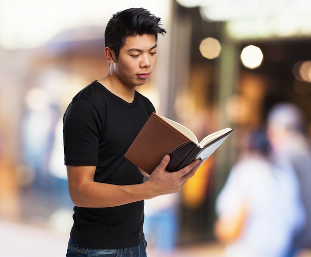 Serious man reading a book