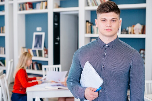 Serious man with notebook