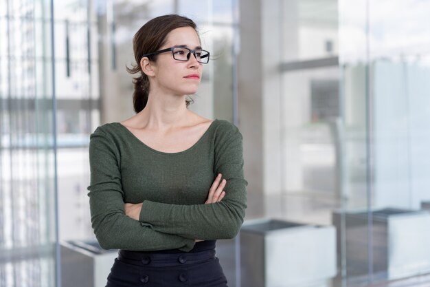 Serious office assistant waiting for corporate partners