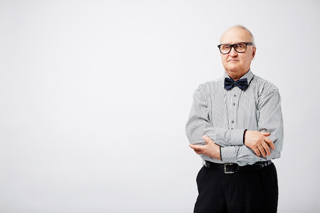 Serious old man with bow tie