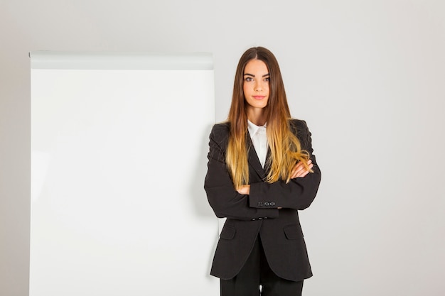 Serious professional woman with whiteboard