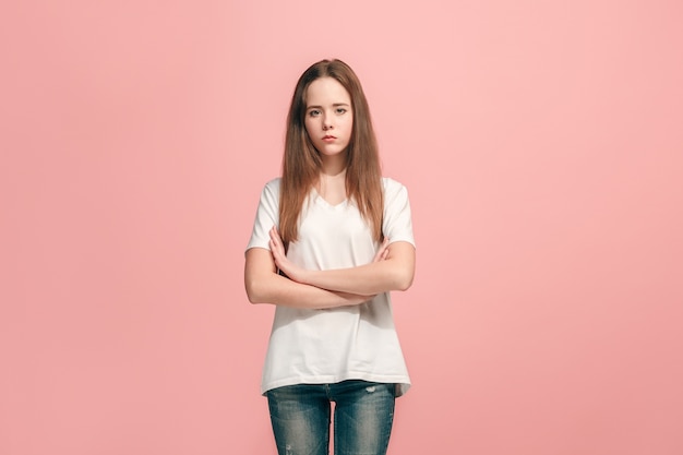 Serious, sad, doubtful, thoughtful teen girl standing at studio.