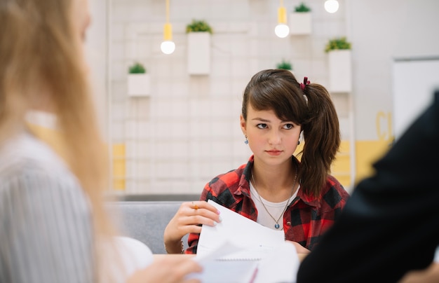 Serious schoolgirl in classroom