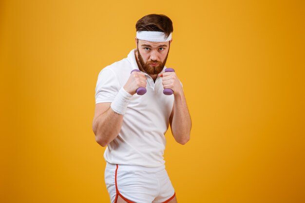 Serious sportsman showing his fists