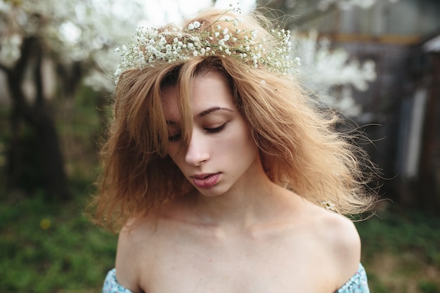 Free photo serious teen with a wreath on her head