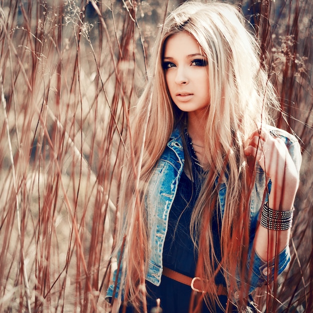 Serious teenager walking in the countryside in spring