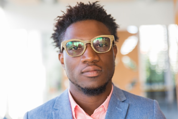 Free Photo | Serious trendy guy posing indoors