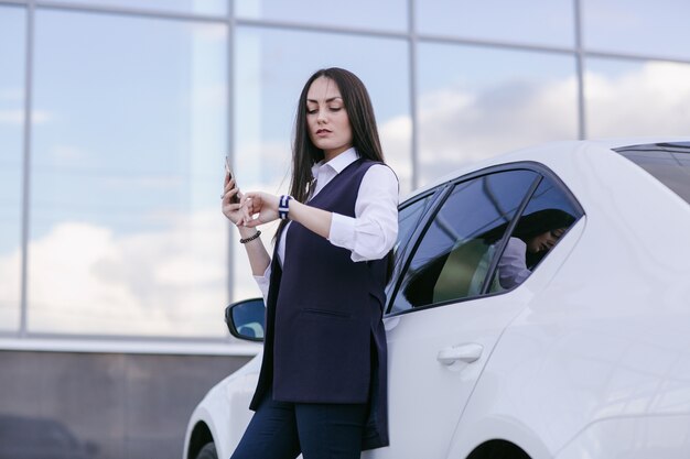 Serious woman looking at the time