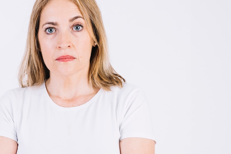 Free Photo serious woman raising eyebrow