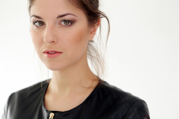 Serious woman on a white background