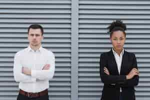 Free photo serious workers posing front view