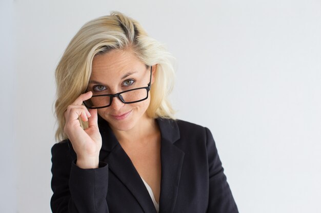 Serious young businesswoman wearing eyeglasses