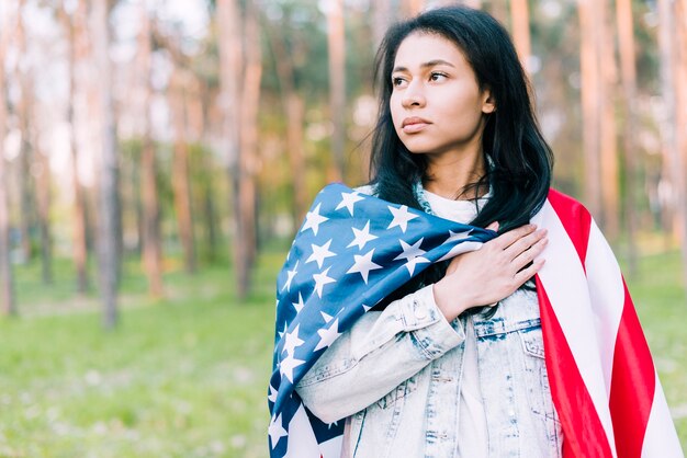 Serious young female with USA flag