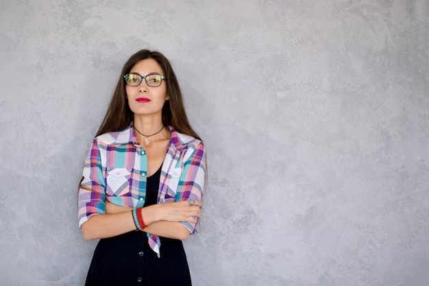 Serious young woman wearing glasses