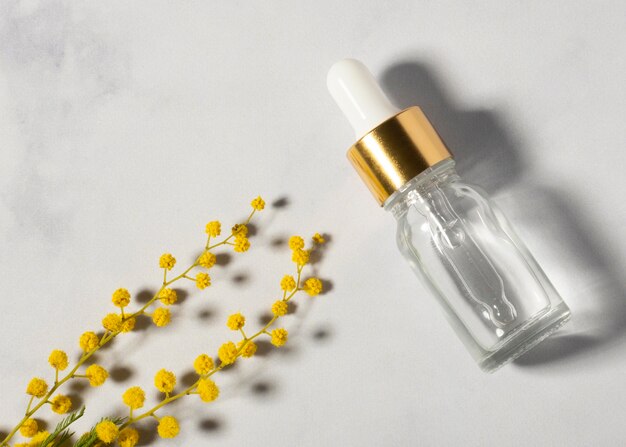 Serum bottle and plant top view