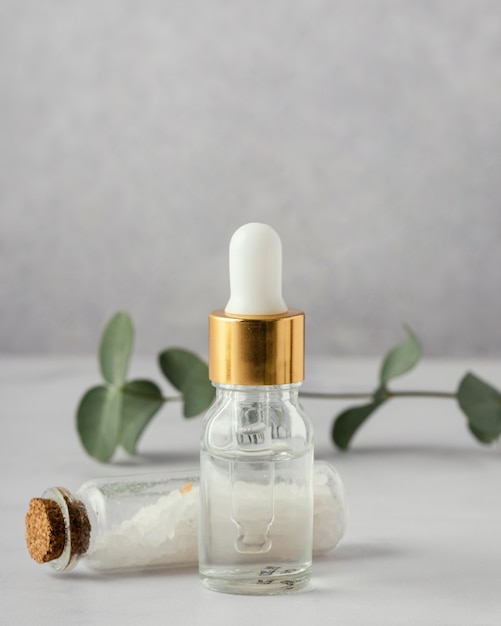 Serum bottle, salt and plant