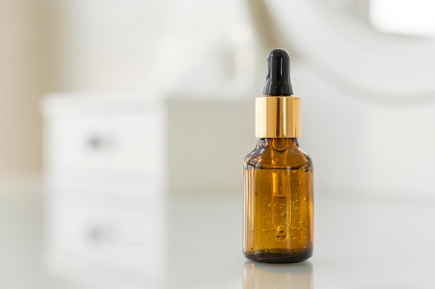 Free photo serum bottle on table