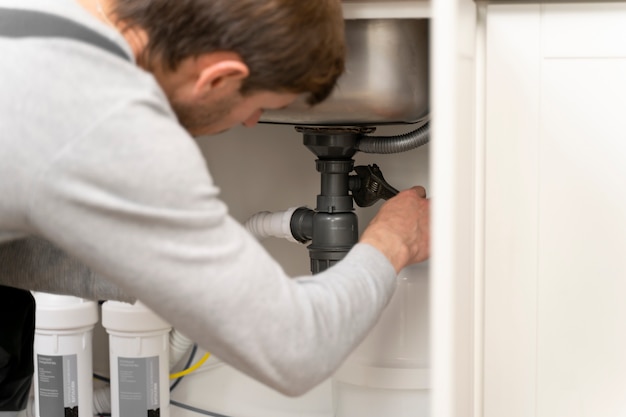 Service maintenance worker repairing