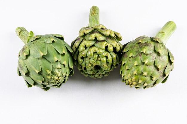 Set of and artichokes on a white background. high angle view.