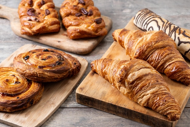 Set of bakery pastries on wooden table