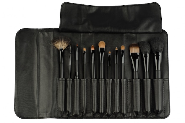 Set of black makeup brushes isolated on white