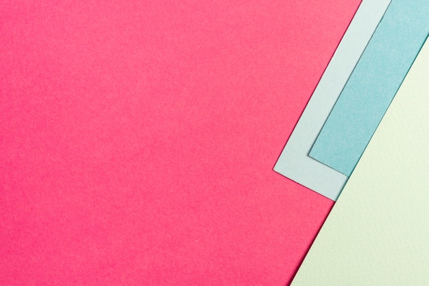 Set of blue and pink paper sheets with copy space