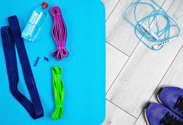 Set of bright latex rubber rubber bands for fitness, yoga mat and bottle of water