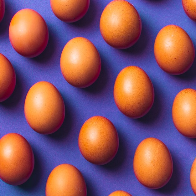 Set of brown chicken eggs on board