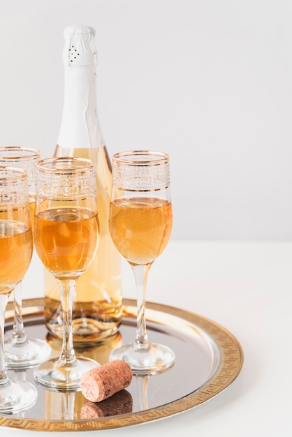 Set of champagne glasses on a tray