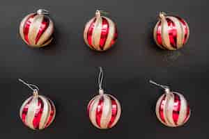 Free photo set of christmas baubles on dark board