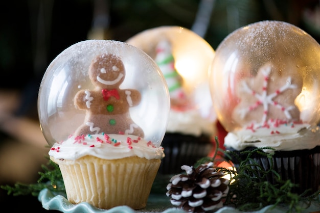 Set of Christmas cupcake snow globes