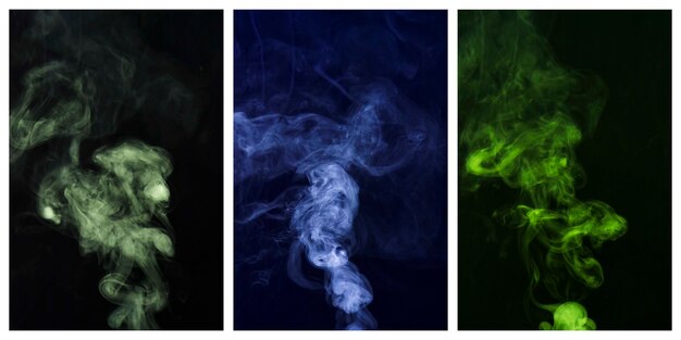 Set of colorful smoke swirling around against black background