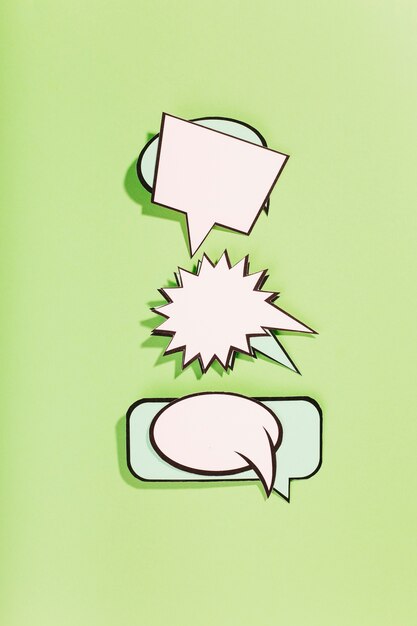 Set of comic bubbles against green background