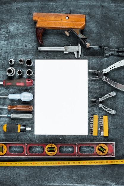 Free photo the set of construction tools on wooden table