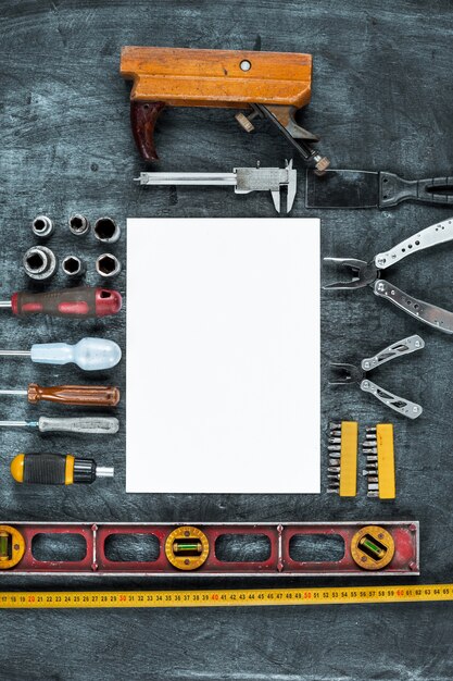 The set of construction tools on wooden table