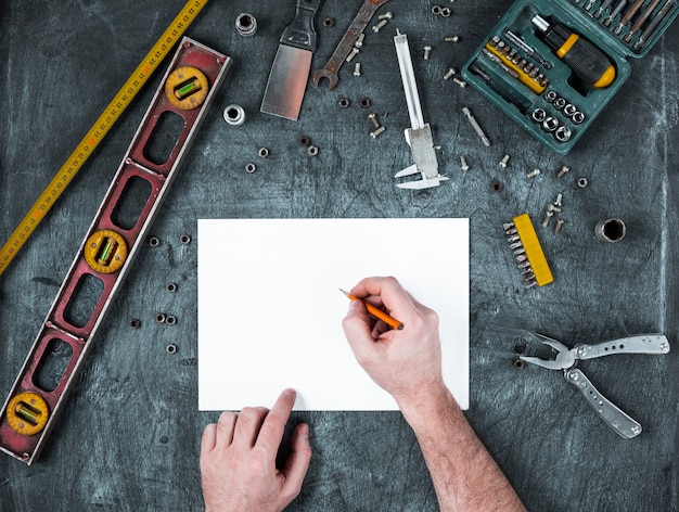 Set of construction tools on wooden table