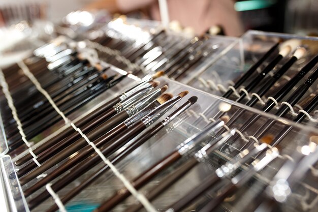 Set of cosmetic brushes in shop window.