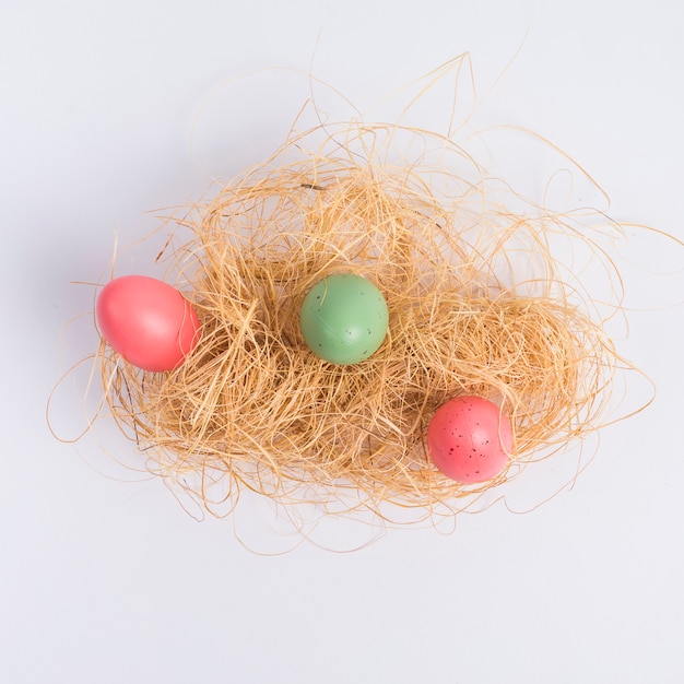 Free photo set of easter eggs between hay