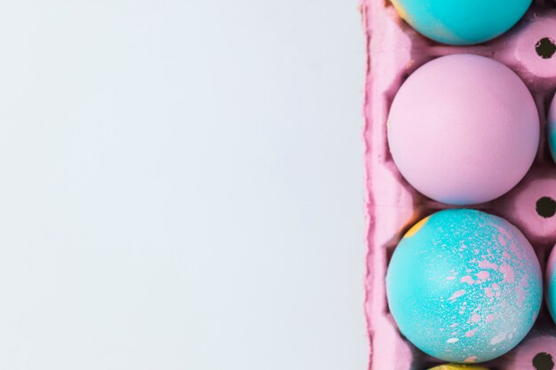 Set of Easter eggs in pink container