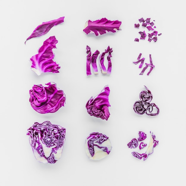 Set of fresh chopped purple cabbage on white background