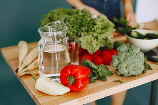 Set of fresh raw vegetables. Products on a table in a modern kitchen room. Healthy Eating. Organic food.