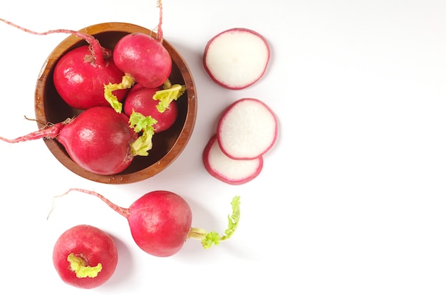 Set of fresh whole small garden radish isolated on white surface cutout. Top view. Flat lay. freshly picked from home growth organic garden. Food concept.