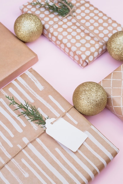 Free photo set of gift boxes in wraps near christmas balls