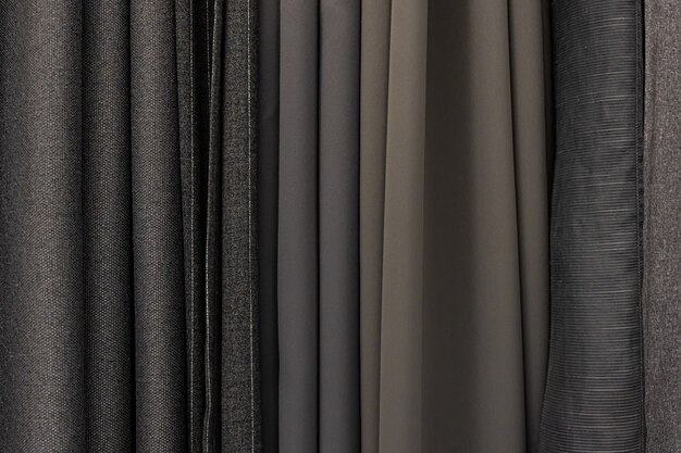 Set of grey dense fabrics of uniform texture, choice of materials in grey colors.