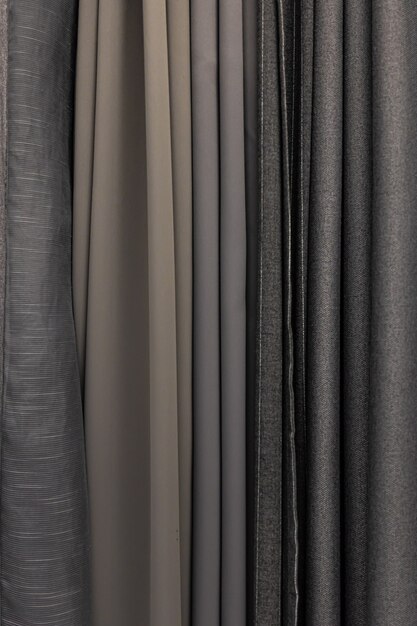 Set of grey dense fabrics of uniform texture, choice of materials in grey colors.