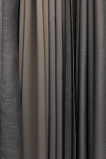 Set of grey dense fabrics of uniform texture, choice of materials in grey colors.